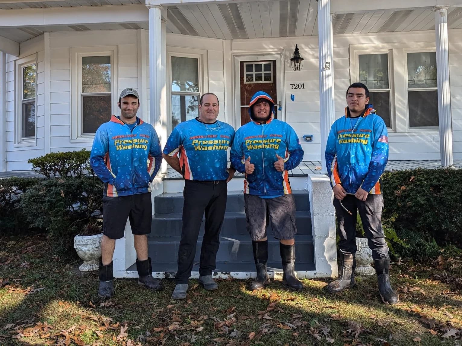 The Absolutely Clean team standing together outside a home